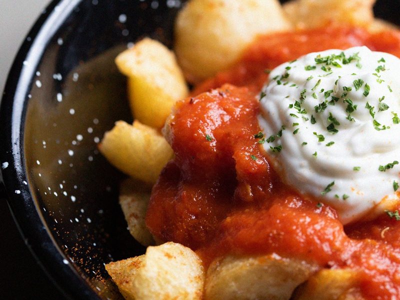 Fried potatoes with brava & garlic sauce,Spanish patatas bravas with spicy tomato sauce and alioli at Llerena